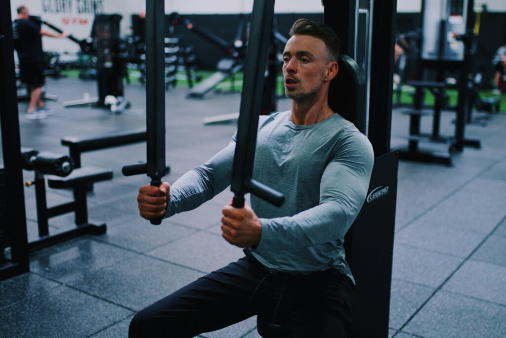 Man performing a machine pec fly