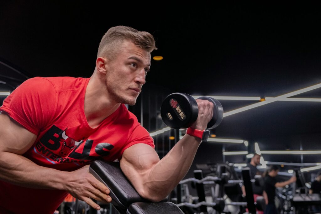 Man performing a dumbbell preacher curl